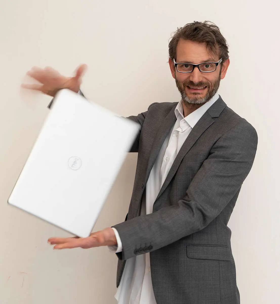 Dave Meyer spinning his computer and smiling